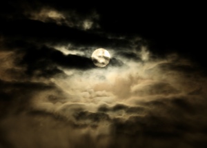 The moon in a moody cloudy sky