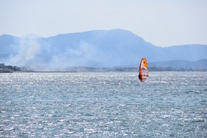 Windsurfer on a mountain lake