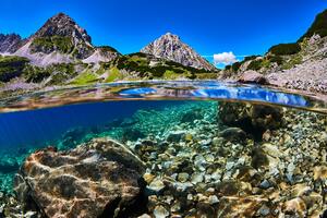 Clear water with mountains in background
