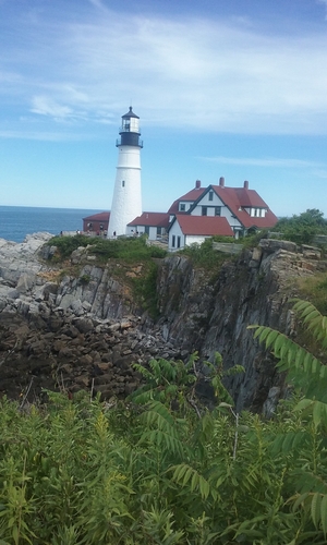 a beautiful lighthouse on a cliff