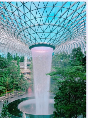 The Jewel waterfall monorail track gardens and visitors Changi Airport Singapore