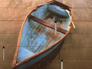 a wooden boat that is painted on boards