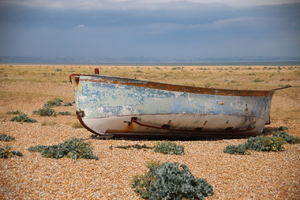 a boat on a deserted beach