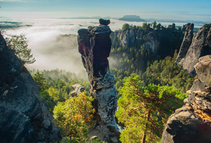 Scenic view over the Bastei and the mist-shouded Elbe.