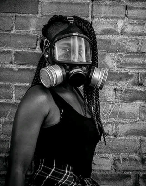 Portrait of woman wearing gasmask