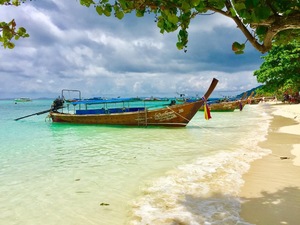 Traditional boat on tropical beach