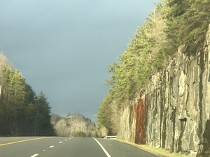 Road alongside rock formation
