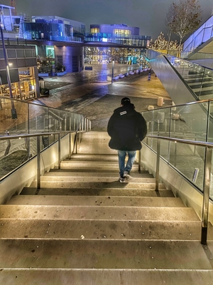 Man walking down he stairs in London