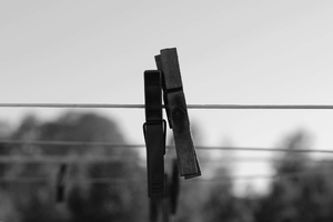 Two clothespins on line in balck and white