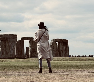 Woman looking at Stonehenge monument