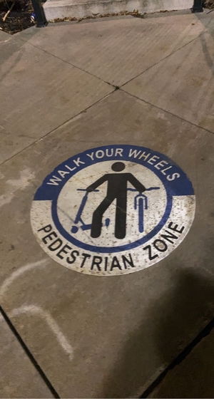 street sign. pedestrian. bicycle lane.