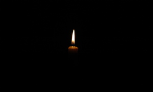 Flame of candle against black background