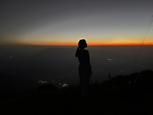 Woman looking at sunrise