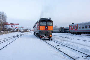 Train at the station on snow covered rails