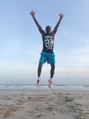 Man jumping in the air during training at the beach
