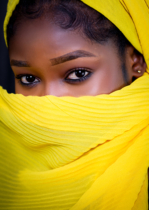 Woman looking through yellow scarf