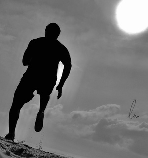 a silhouette picture of morning fitness at the beach.
