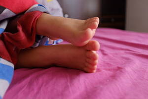Child’s feet in the morning