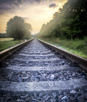 Close up of train tracks at sunset