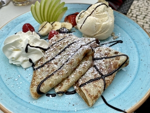 chocolate crepes with fresh fruit and vanilla ice cream