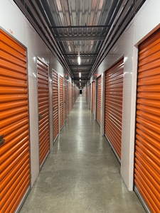 long hallway with metal orange doors