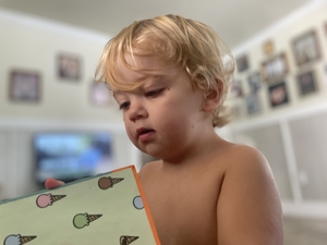 Close up of child looking into a book
