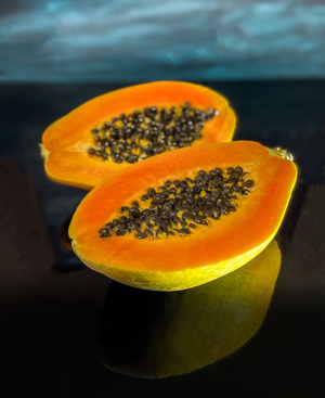 Papaya in black background