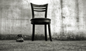 Old chair and shoe black and white