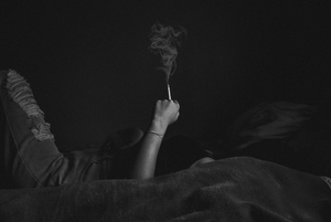 Woman holding cigarette black and white fine art.