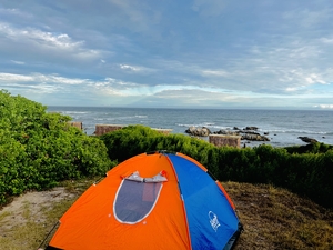 Tent on grassland near the coast