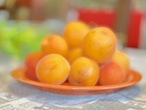 A cup with fresh apricots