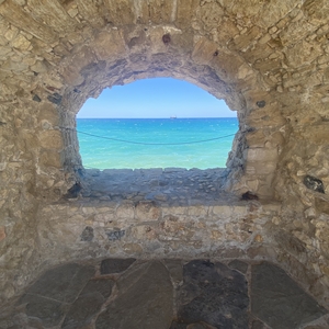 photo of the sea in Crete a light house site window