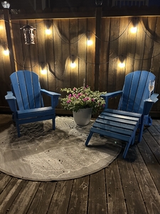 Two chairs in garden at night