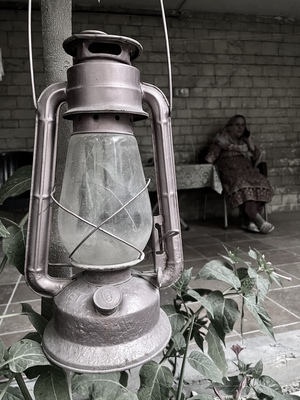 the old caroseane oil lamp and a lady