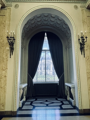 castle window with long curtains