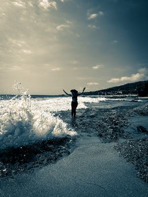 woman playing in the ocean waves