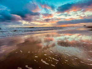 sky reflection on the beach