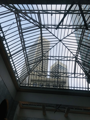 Skyscrapers seen through glass ceiling